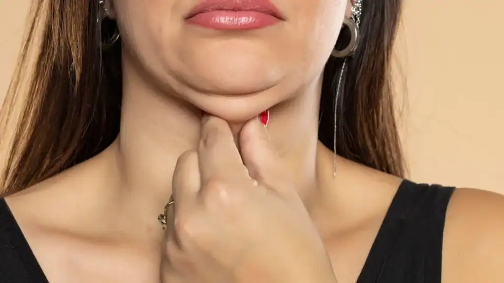 An image of a woman with double chin, sad, worried : Non Surgical Double Chin Removal Treatment in Wantage, UK